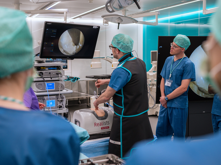 Surgeon performs an endoscopic demonstration on a Realist model in the Skills Lab of the OR-X.