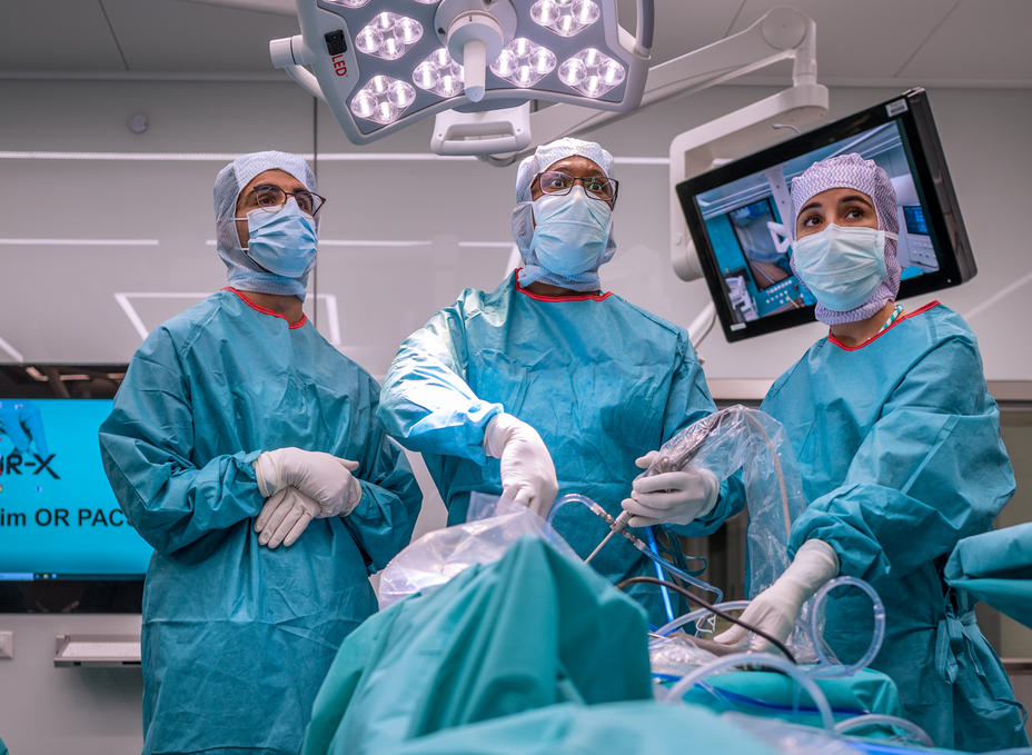Three surgeons perform an arthroscopic procedure in the OR-X.