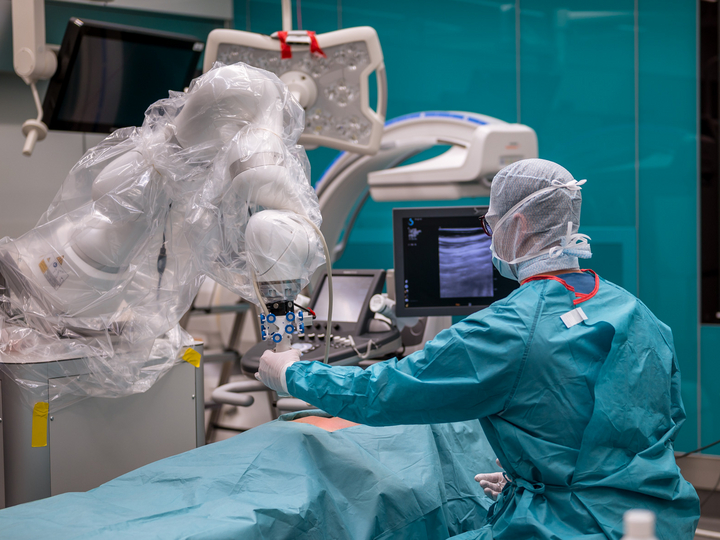 Using an ultrasonic probe on a KUKA robot, data for the Data Hub is collected on a specimen.
