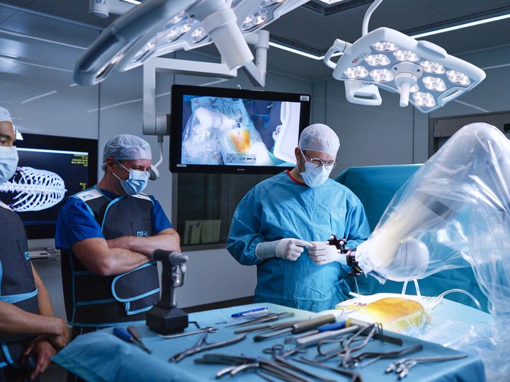 Surgeons and researchers perform a robotic surgery experiment